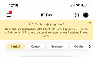 Interfața unei aplicații mobile afișează un mesaj de mentenanță programată pe un fundal galben, deasupra unor butoane rotunjite etichetate cu diverse categorii financiare.
