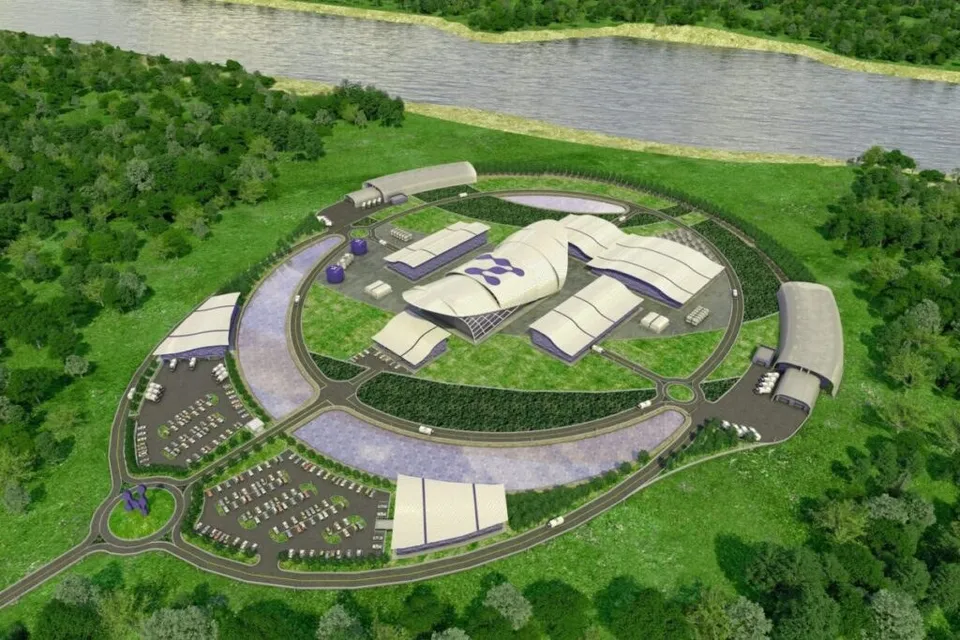 O reprezentare grafică de sus a unui complex de clădiri albe cu acoperișuri curbate, înconjurat de drumuri, parcări și vegetație verde.