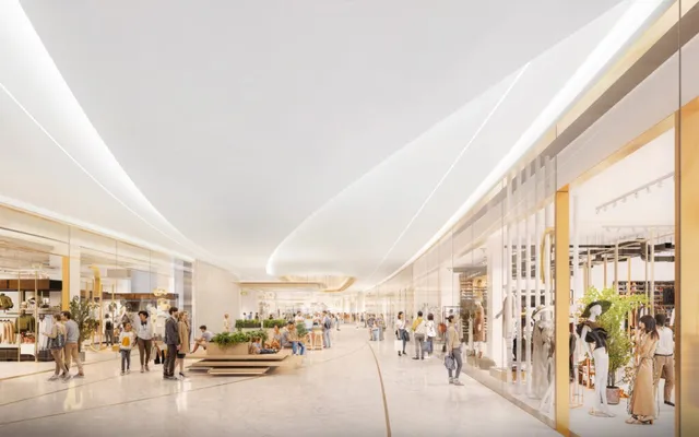 O reprezentare digitală a unui coridor de mall cu vitrine de magazine, tavan alb curbat și persoane care merg pe un podea lucioasă.