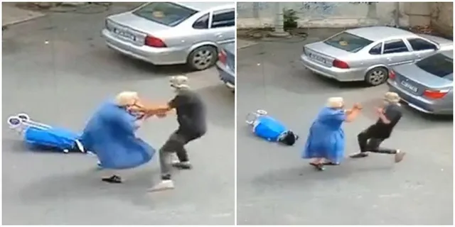 Un bărbat în haine negre stă în genunchi lângă o femeie în rochie albastră care se află întinsă pe asfalt lângă un scaun cu rotile.