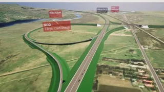 O reprezentare digitală 3D a unei intersecții rutiere cu drumuri cu mai multe benzi, vegetație verde și câteva etichete de text plutitoare în planul de fundal.