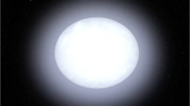 O sferă luminoasă albă strălucitoare este centrată pe un fundal negru presărat cu mici puncte luminoase.