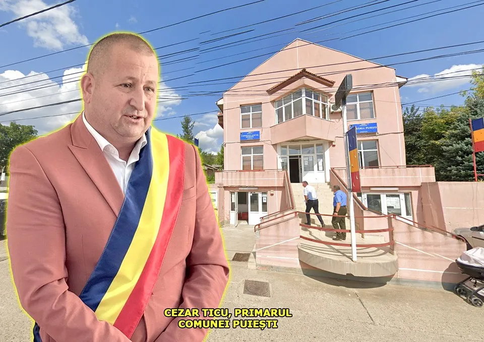 Un bărbat cu sacou roz și o bandă tricoloră poartă haine formale în fața unei clădiri cu ferestre mari și scări exterioare.