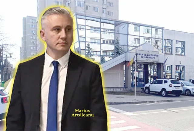 Un bărbat într-un costum negru și cravată albastră stă în prim-plan, având în fundal o clădire cu ferestre mari și câteva mașini parcate.