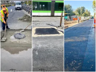 Un lucrător cu vestă reflectorizantă folosește o lopată pe un drum de beton lângă un manhole, alături de un tramvai și o porțiune de asfalt.