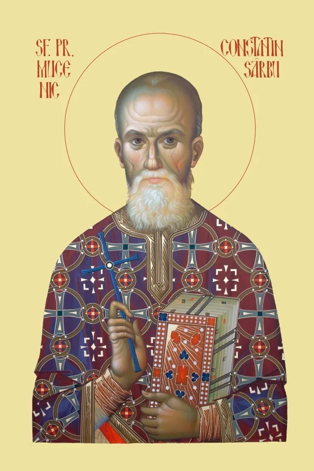 O iconă reprezintă un bărbat cu barbă albă, îmbrăcat în vestimentații liturgice ornamentate, ținând o carte în mână.