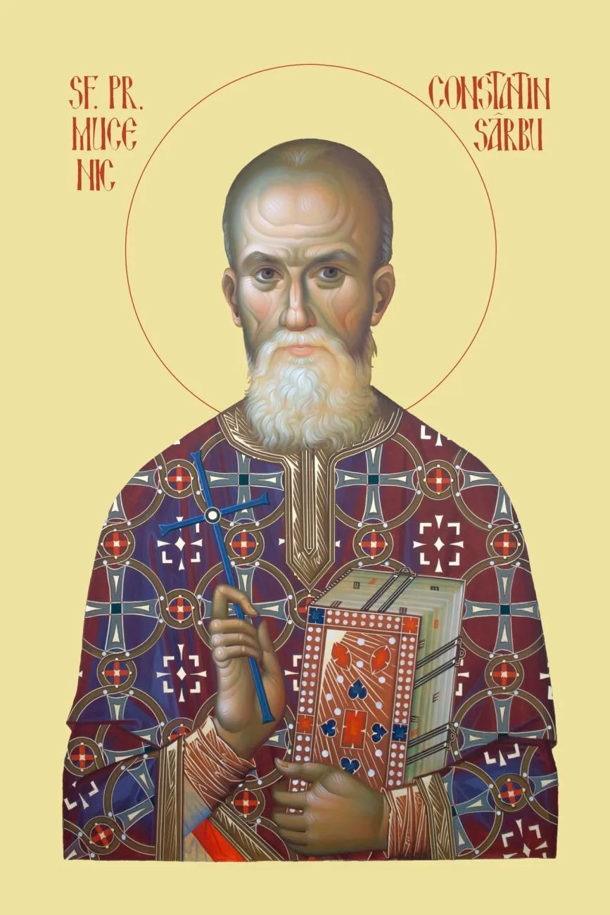 O iconă reprezintă un bărbat cu barbă albă, îmbrăcat în vestimentații liturgice ornamentate, ținând o carte în mână.