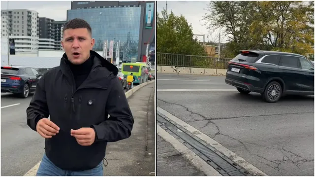 Un bărbat cu o jachetă neagră stă pe un trotuar, în timp ce în partea dreaptă se observă o porțiune de asfalt crăpată și un automobil în mișcare.