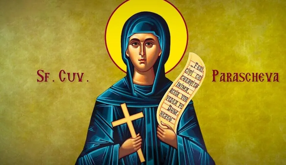 O pictură religioasă reprezintă o femeie cu mantie albastră, purtând o aură galbenă în jurul capului, o cruce de lemn și un pergament scris.