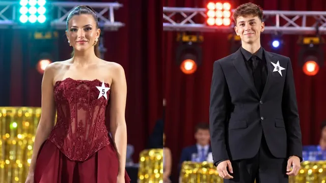 O femeie într-o rochie roșie cu numărul 5 și un bărbat într-un costum negru cu numărul 8 stau în fața unui fundal cu lumini.