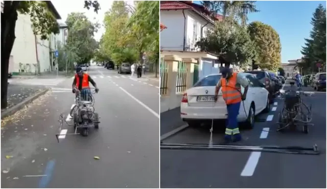Un bărbat cu vestă portocalie și cască conduce un vehicul cu trei roți pe un drum asfaltat lângă copaci.