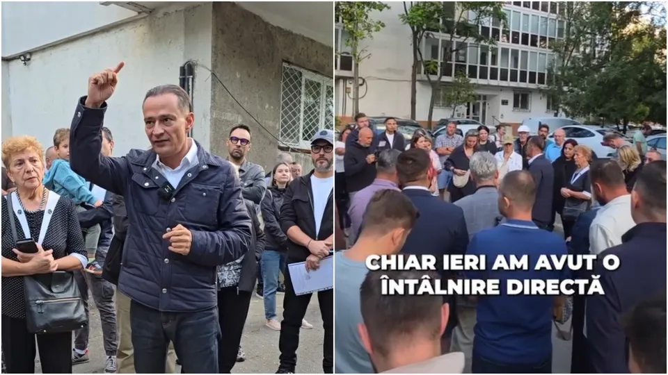 Un bărbat într-o jachetă închisă ridică mâna stângă, în timp ce un grup de persoane stă în spatele lui pe o stradă lângă un clădire.