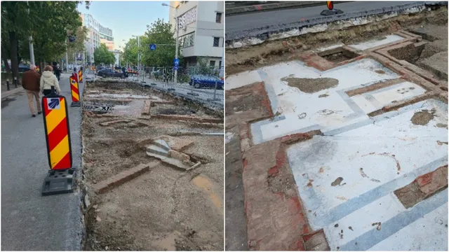 Imaginea arată o șantier de construcție pe o stradă cu lini de tramvai, cu fundații de beton și ziduri de cărămidă băgate în evidență, delimimită de parapeți de securitate cu bandă roșu-galbenă.