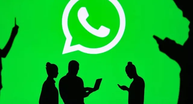 Silhouette figures are shown interacting with devices in front of a large green screen displaying the WhatsApp logo.