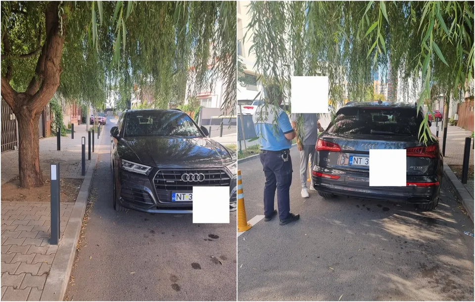 Un vehicul negru este parcat pe o porțiune de drum îngustă între două rânduri de stâlpișori, lângă un copac și un trotuar.