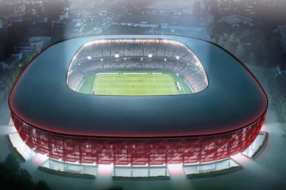 O reprezentare digitală a unui stadion mare cu o suprafață de joc verde și tribune pline de spectatori sub un acoperiș oval.