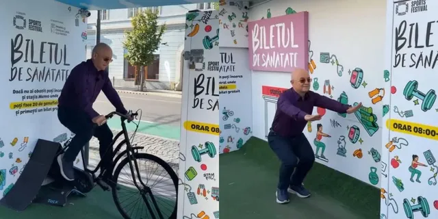Un bărbat pedalează pe o bicicletă fixă, iar un alt bărbat execută genuflexiuni în fața unui panou publicitar alb cu grafice colorate.