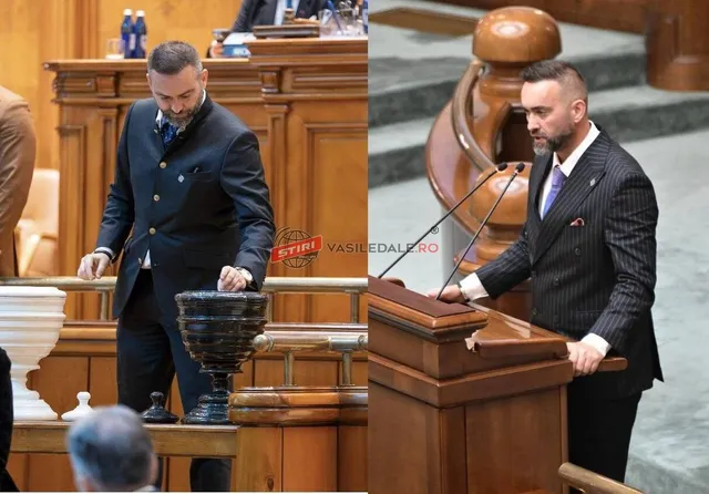 Un bărbat cu barbă, îmbrăcat în costum închis la culoare, stă în picioare lângă un pupitru de lemn într-o încăpere cu mobilier din lemn.