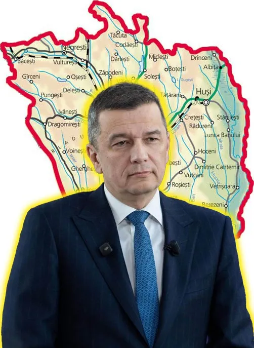 Un bărbat cu sacou închis și cravată albastră stă în fața unei hărți a unui județ cu contur roșu.