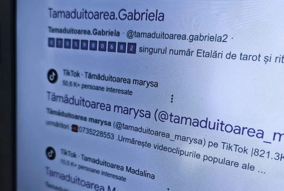 Un ecran de dispozitiv digital afișează profiluri de utilizatori de pe o platformă socială cu nume de utilizator și numere de telefon.