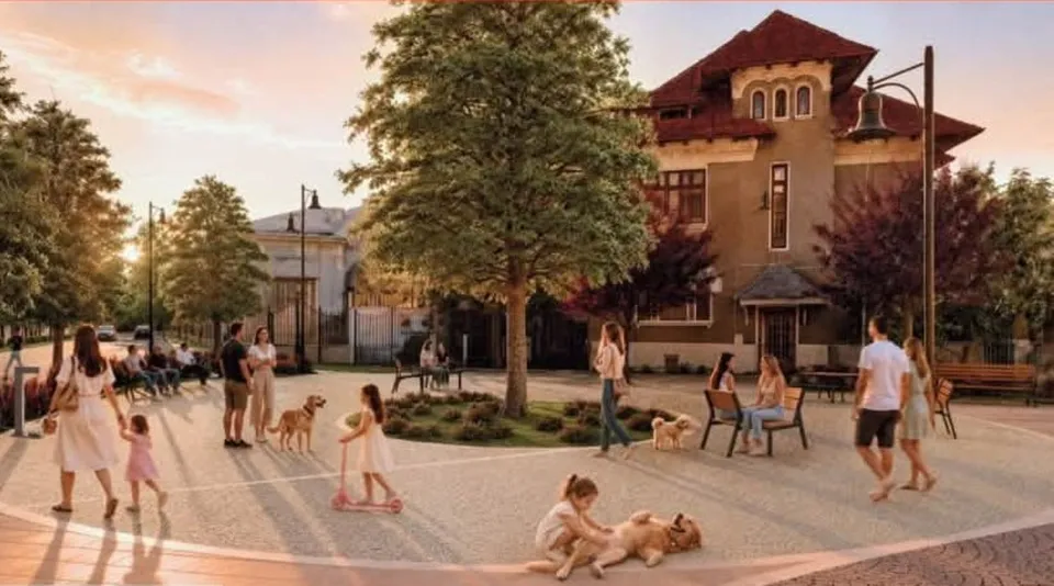 Oamenii se plimbă, stau pe bănci sau se joacă cu câini într-o piață pietonală cu copaci și clădiri în fundal sub un cer luminos.