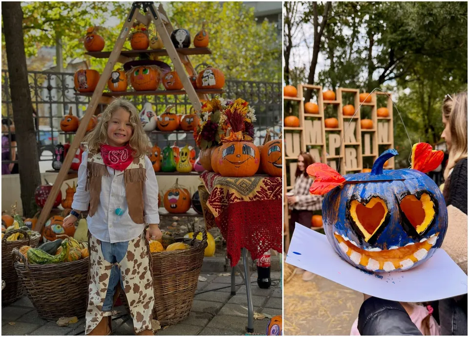 O copilă îmbrăcată în costum de animal stă lângă coșuri cu dovleci și o structură de lemn decorată cu dovleci sculptați.