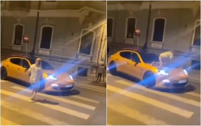 Un vehicul galben este oprit pe o trecere de pietoni, iar o persoană este poziționată pe capota mașinii.