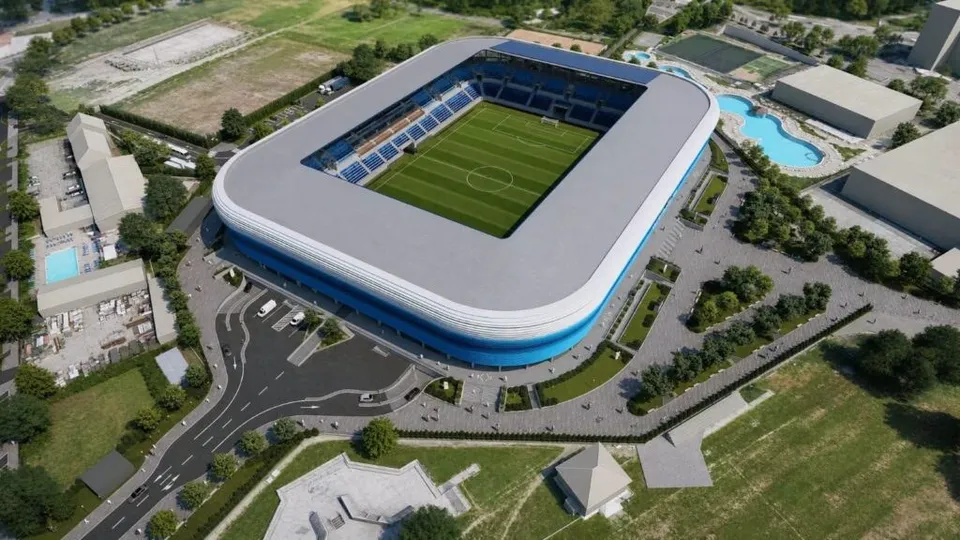 O reprezentare digitală de tip randare arată un stadion modern cu un teren de fotbal verde și tribune înconjurat de drumuri și vegetație.
