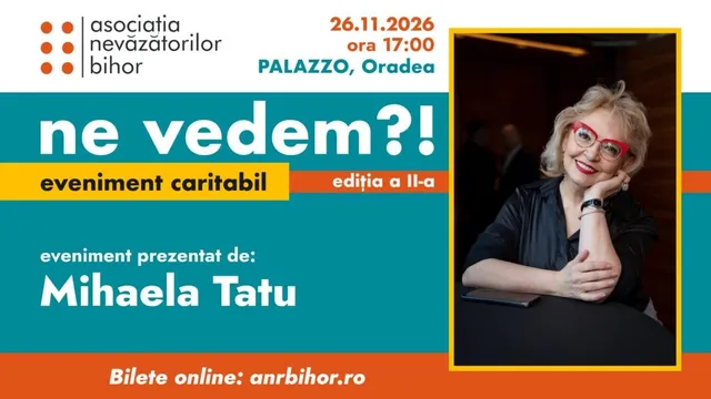O femeie cu ochelari roșii stă la o masă, sprijinindu-și bărbia de o mână, într-un cadru cu fundal întunecat.